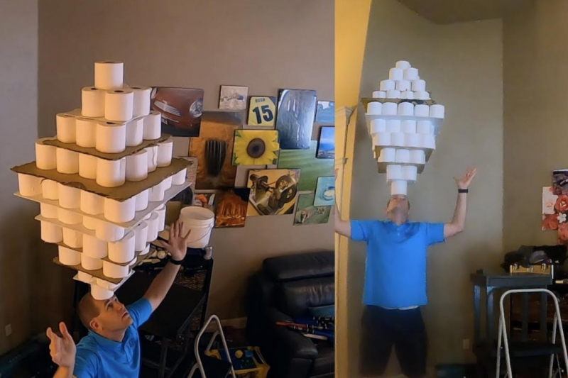 Kafasının üzerinde 101 tuvalet kağıdı rulosu taşıyarak rekor kırdı