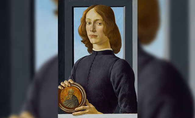 young man holding a roundel